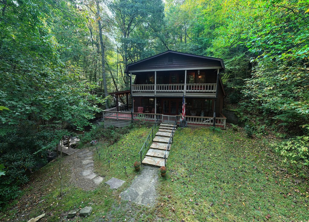4836 Swallows Creek Road Hiawassee, GA 30546 - Photo 42 of 57 a view of a house with a yard