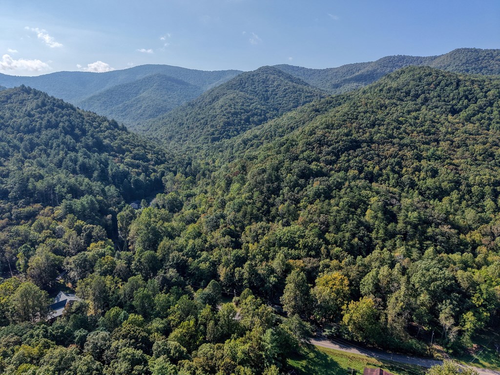 4836 Swallows Creek Road Hiawassee, GA 30546 - Photo 57 of 57 a view of a lush green hillside and a building