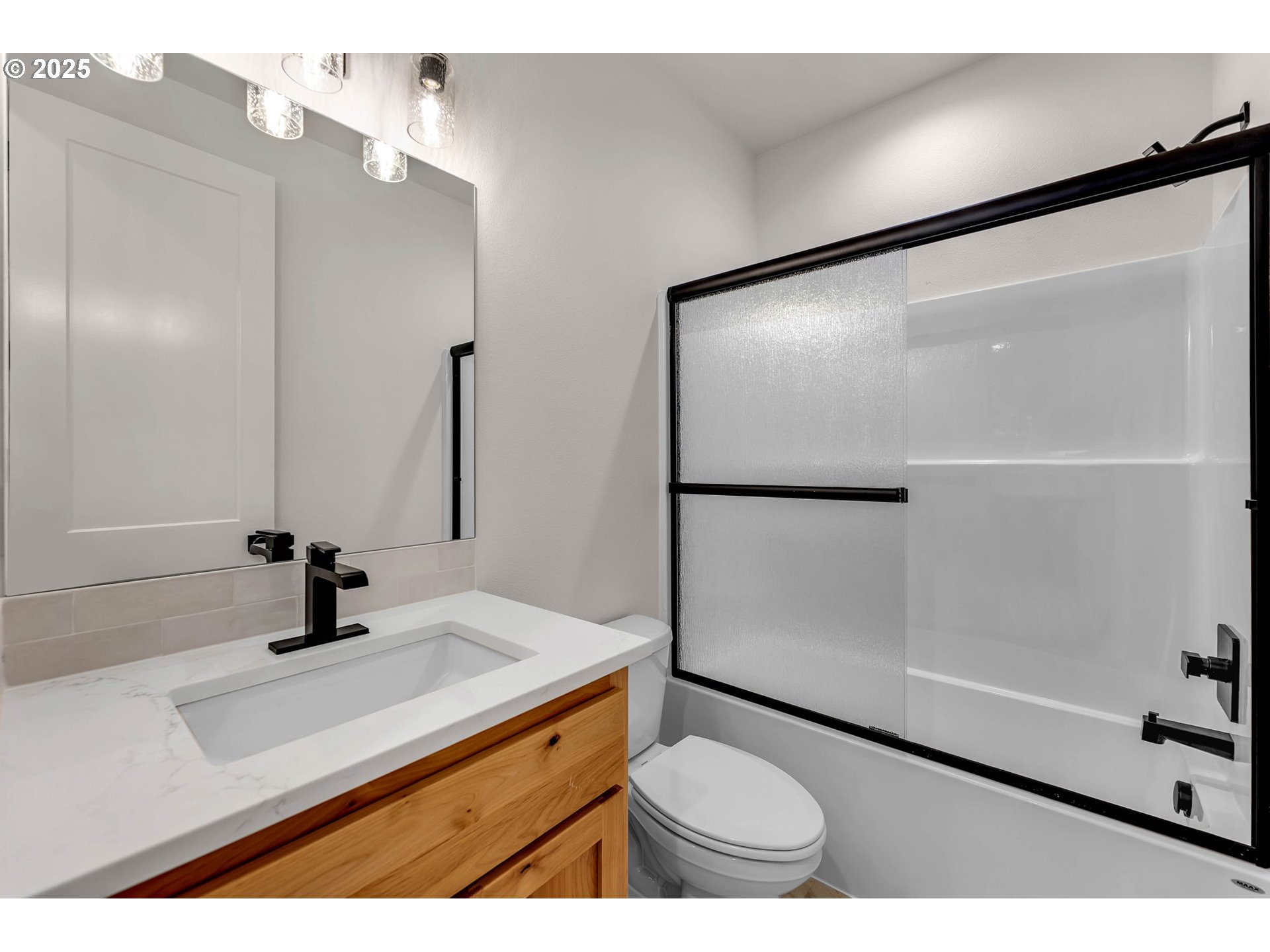 36403 Northeast 267th Street Yacolt, WA 98675 - Photo 15 of 33 a bathroom with a sink a toilet and shower