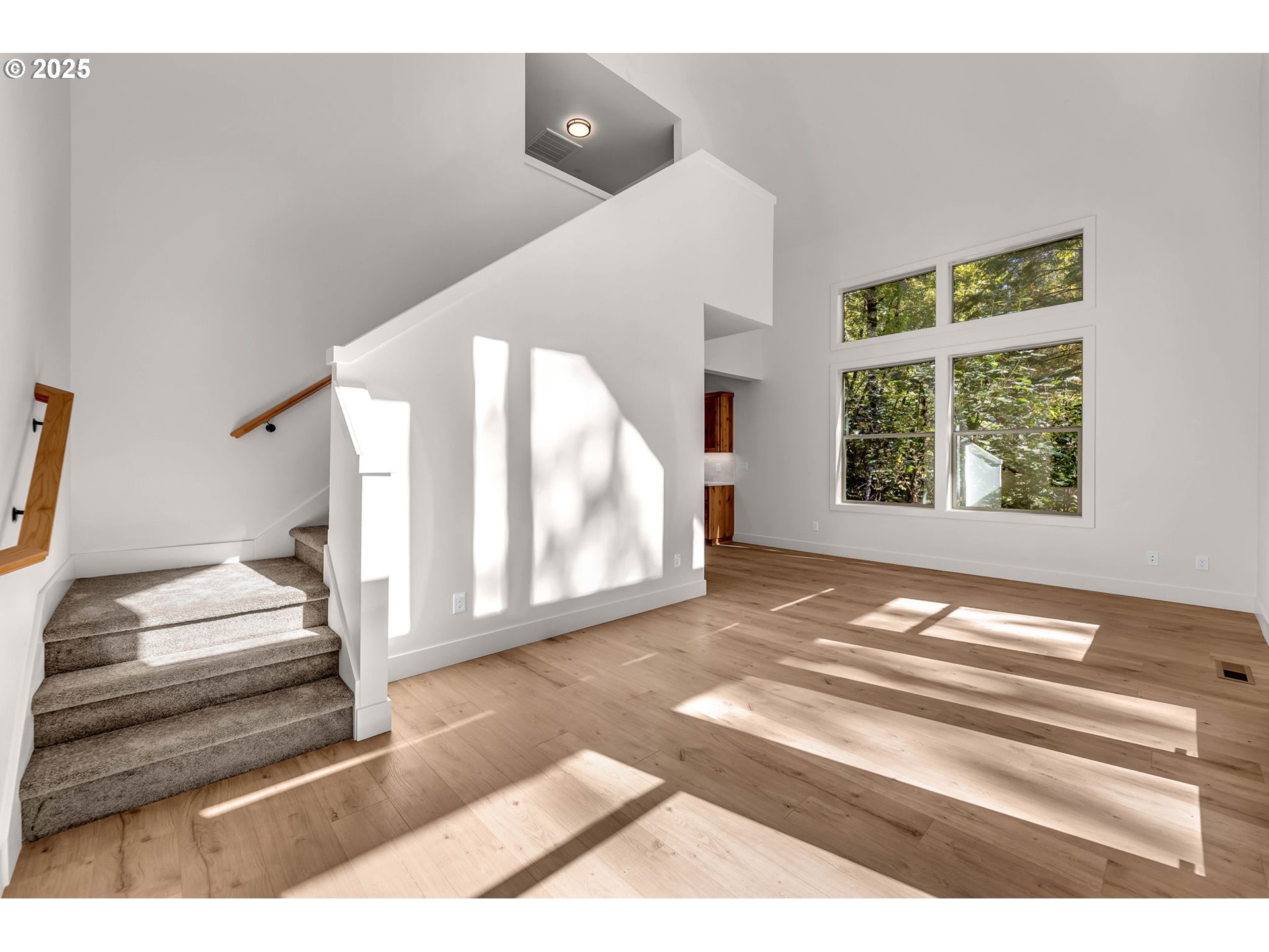 36403 Northeast 267th Street Yacolt, WA 98675 - Photo 18 of 33 a view of a bedroom with wooden floor and windows