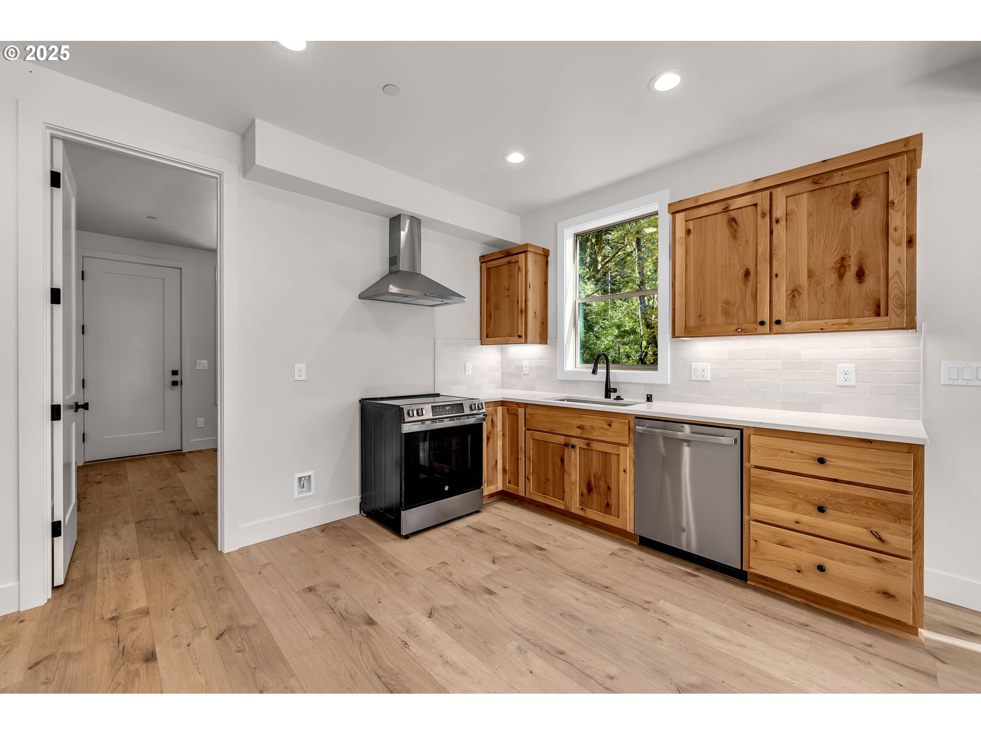 36403 Northeast 267th Street Yacolt, WA 98675 - Photo 7 of 33 a kitchen with granite countertop a stove cabinets and a sink