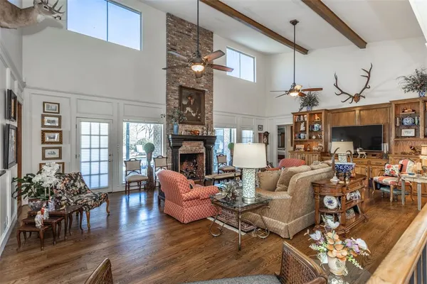 a living room with fireplace furniture and a flat screen tv