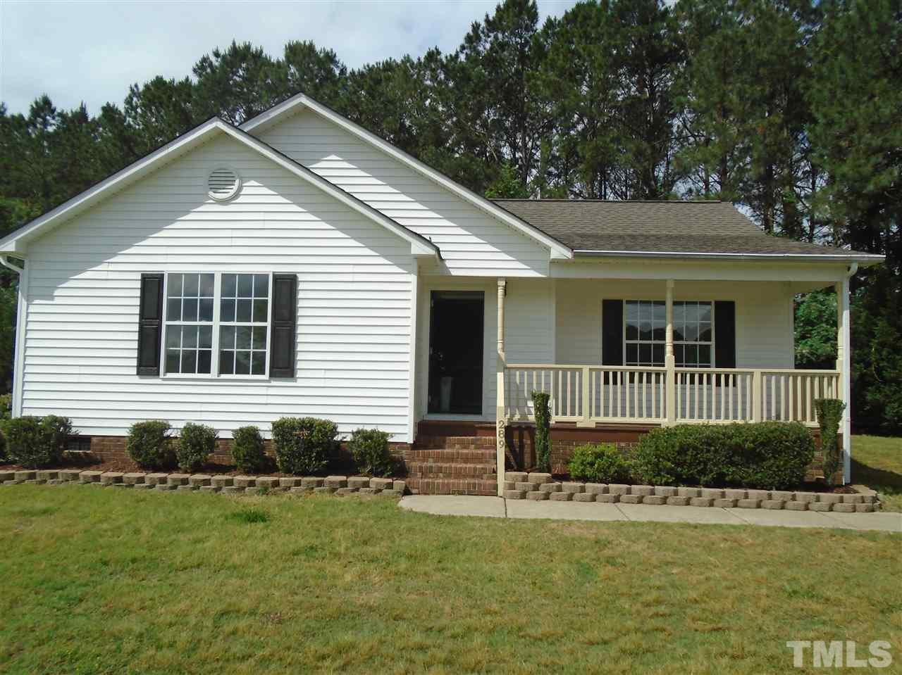 289 Wagner Road Willow Spring, NC 27592 - Photo 1 of 12 a front view of a house with a yard