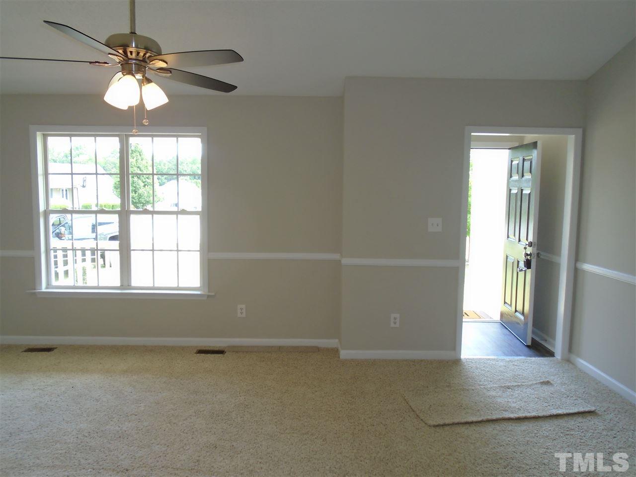 289 Wagner Road Willow Spring, NC 27592 - Photo 5 of 12 an empty room with fan and windows