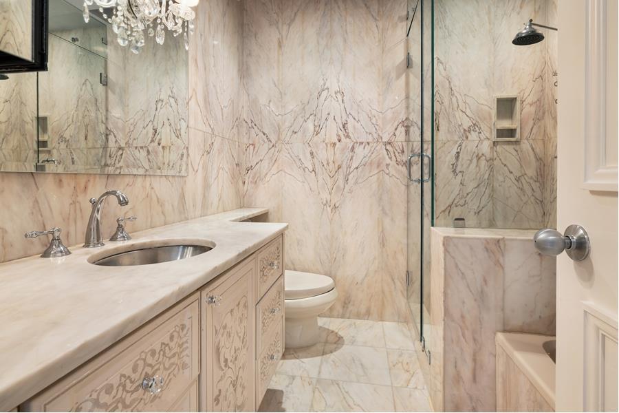 530 East 76th Street, Unit 21HJK Manhattan, NY 10021 - Photo 13 of 21 a bathroom with a sink and toilet