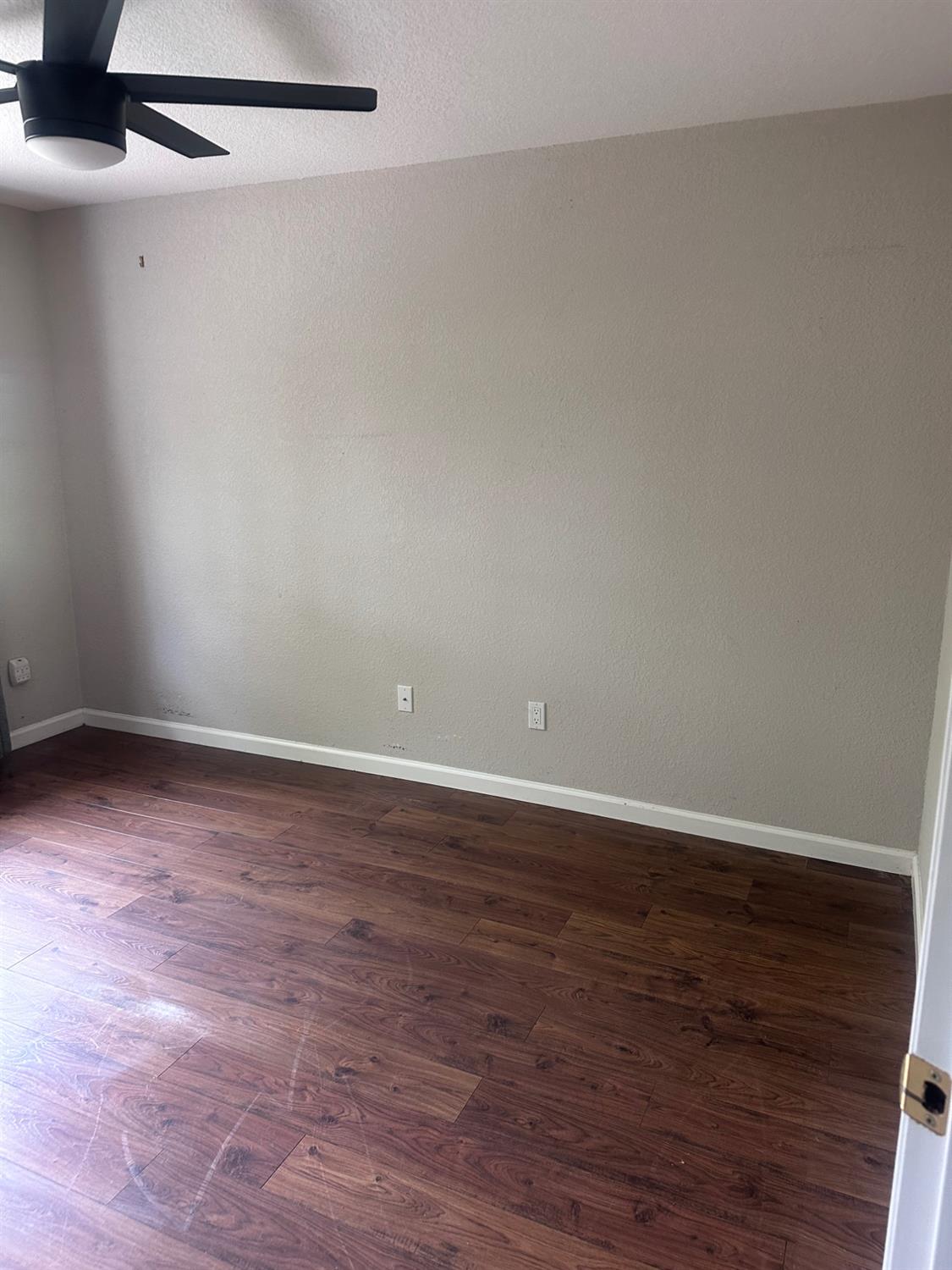 7124 Ospital Road Valley Springs, CA 95252 - Photo 17 of 37 a view of an empty room with wooden floor