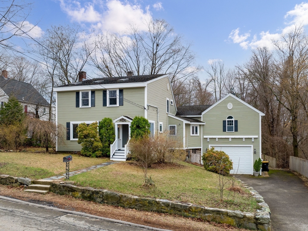 55 Kellogg Street Framingham, MA 01701 - Photo 1 of 42 a front view of a house with garden
