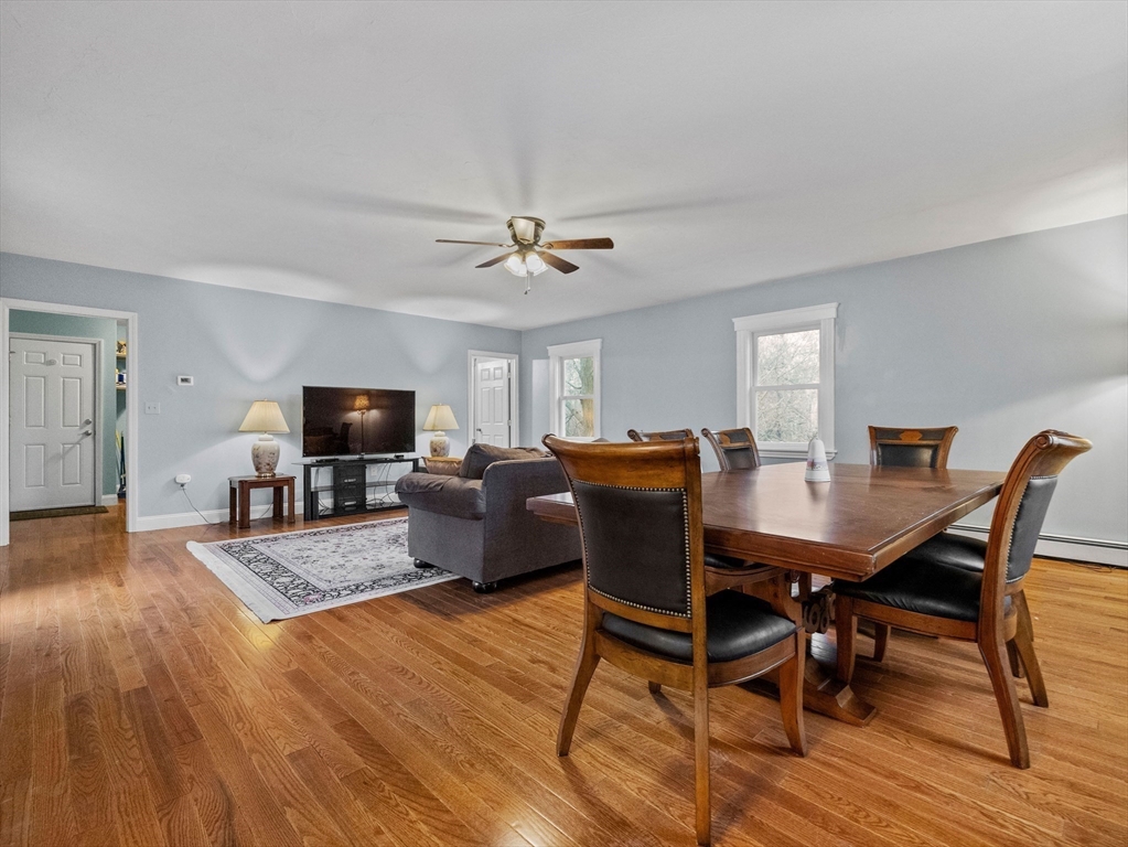 55 Kellogg Street Framingham, MA 01701 - Photo 16 of 42 a living room with furniture a flat screen tv and a table