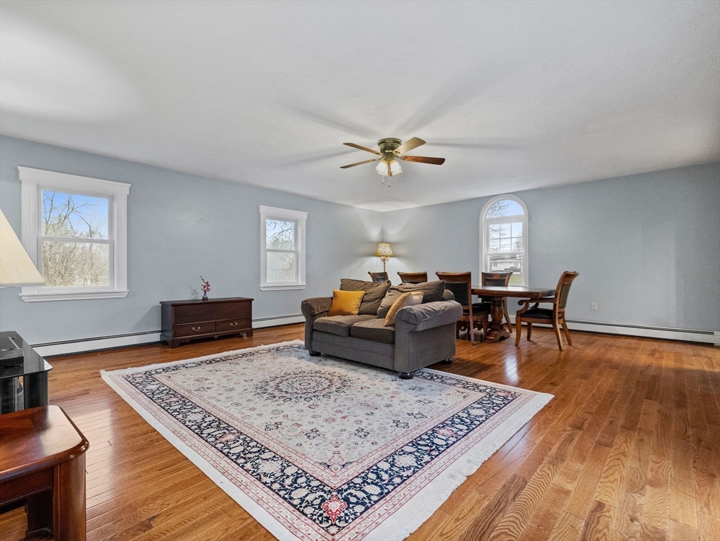 55 Kellogg Street Framingham, MA 01701 - Photo 17 of 42 a living room with furniture and wooden floor