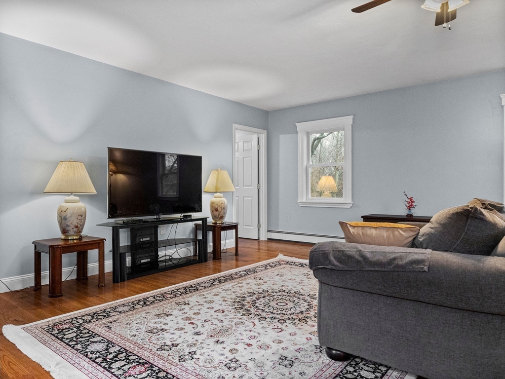55 Kellogg Street Framingham, MA 01701 - Photo 19 of 42 a living room with furniture and a flat screen tv