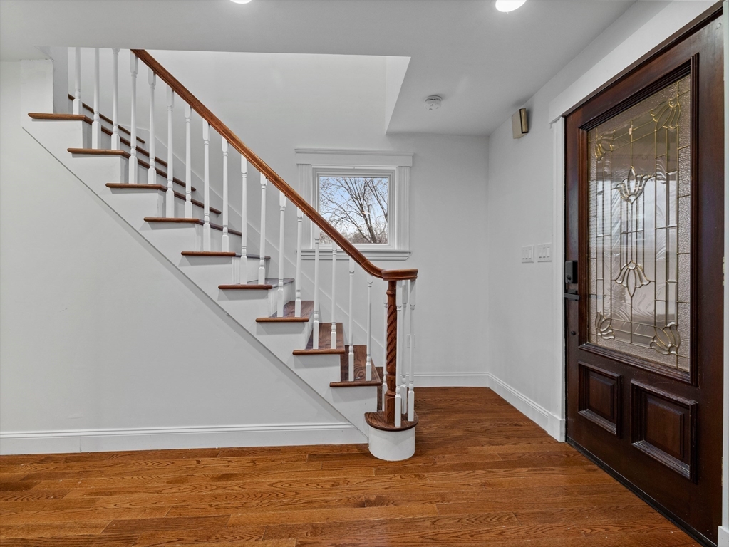 55 Kellogg Street Framingham, MA 01701 - Photo 2 of 42 a view of entryway and hall with wooden floor