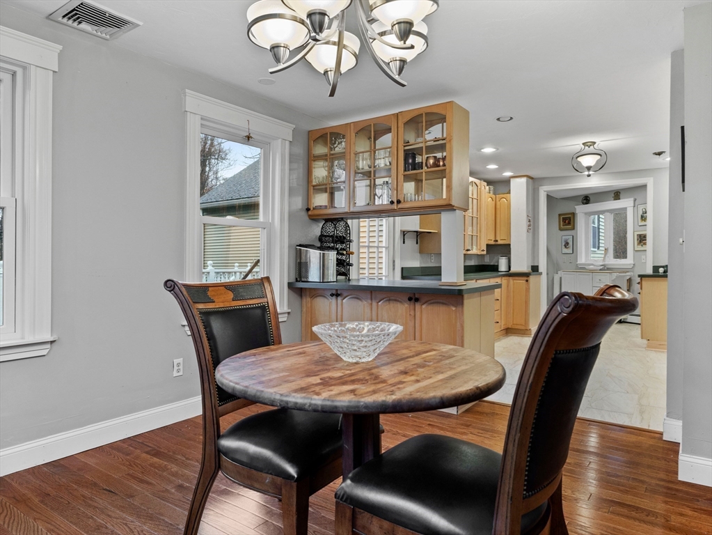 55 Kellogg Street Framingham, MA 01701 - Photo 7 of 42 a view of a dining room with furniture window and wooden floor