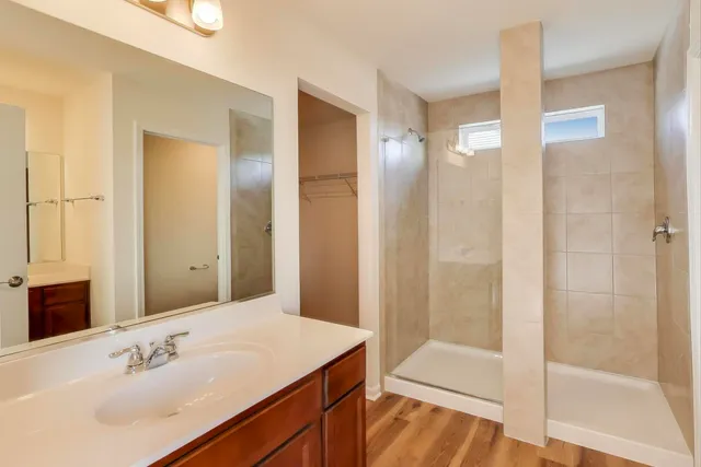 a view of a bathroom with wooden floor