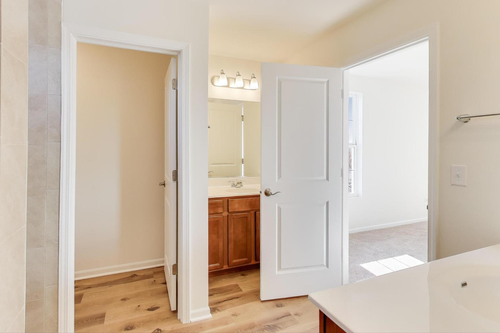 1003 Celebration Drive Aurora, IL 60504 - Photo 15 of 35 a view of a bathroom with wooden floor