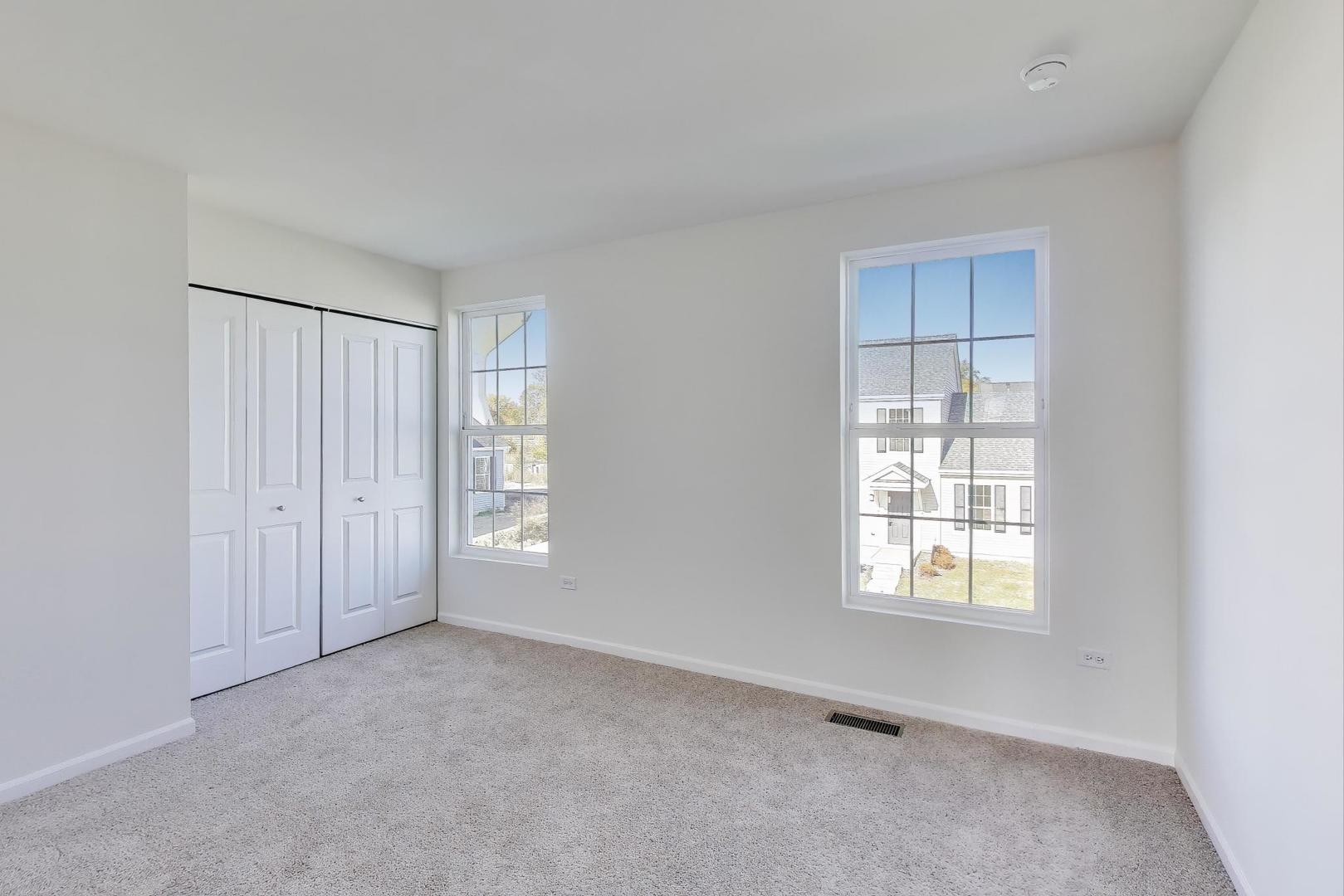 1003 Celebration Drive Aurora, IL 60504 - Photo 18 of 35 a view of an empty room with a window