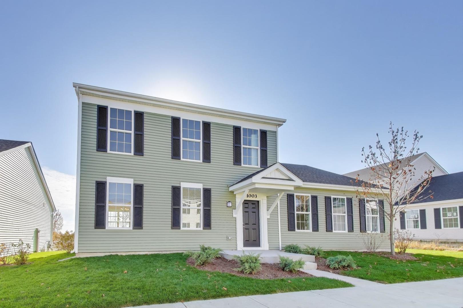 1003 Celebration Drive Aurora, IL 60504 - Photo 2 of 35 a front view of a house with a yard