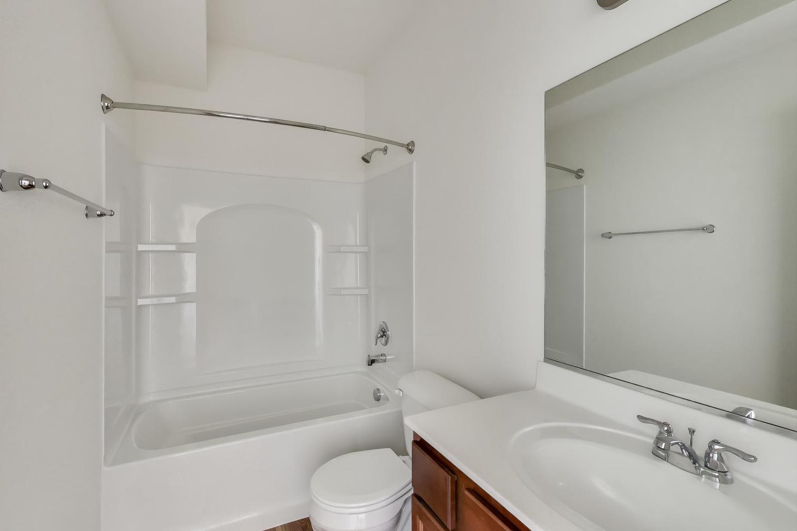 1003 Celebration Drive Aurora, IL 60504 - Photo 22 of 35 a bathroom with a sink toilet and shower
