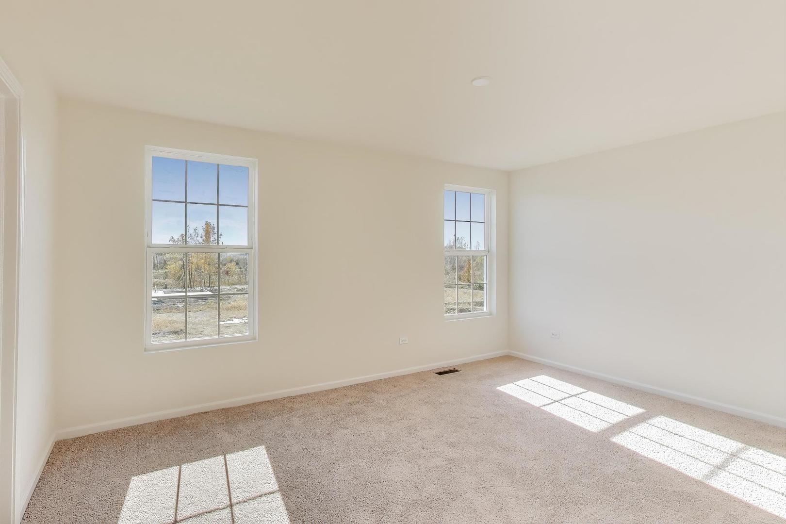 1003 Celebration Drive Aurora, IL 60504 - Photo 24 of 35 an empty room with windows