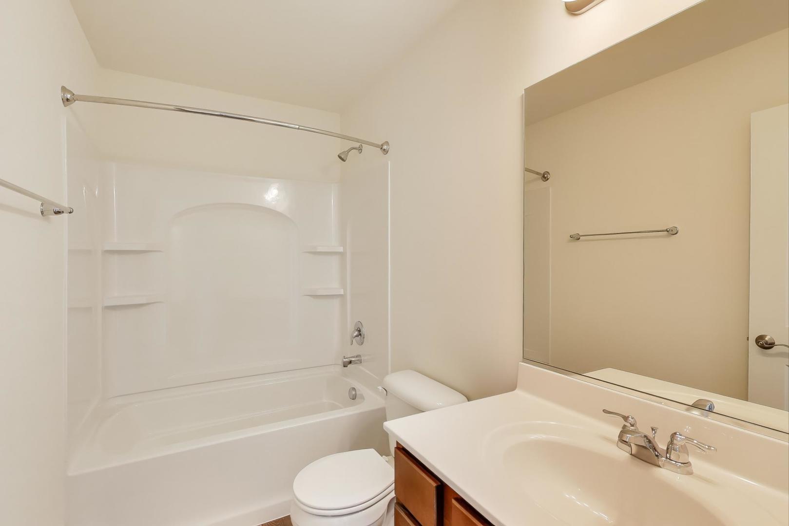 1003 Celebration Drive Aurora, IL 60504 - Photo 29 of 35 a bathroom with a sink toilet and shower