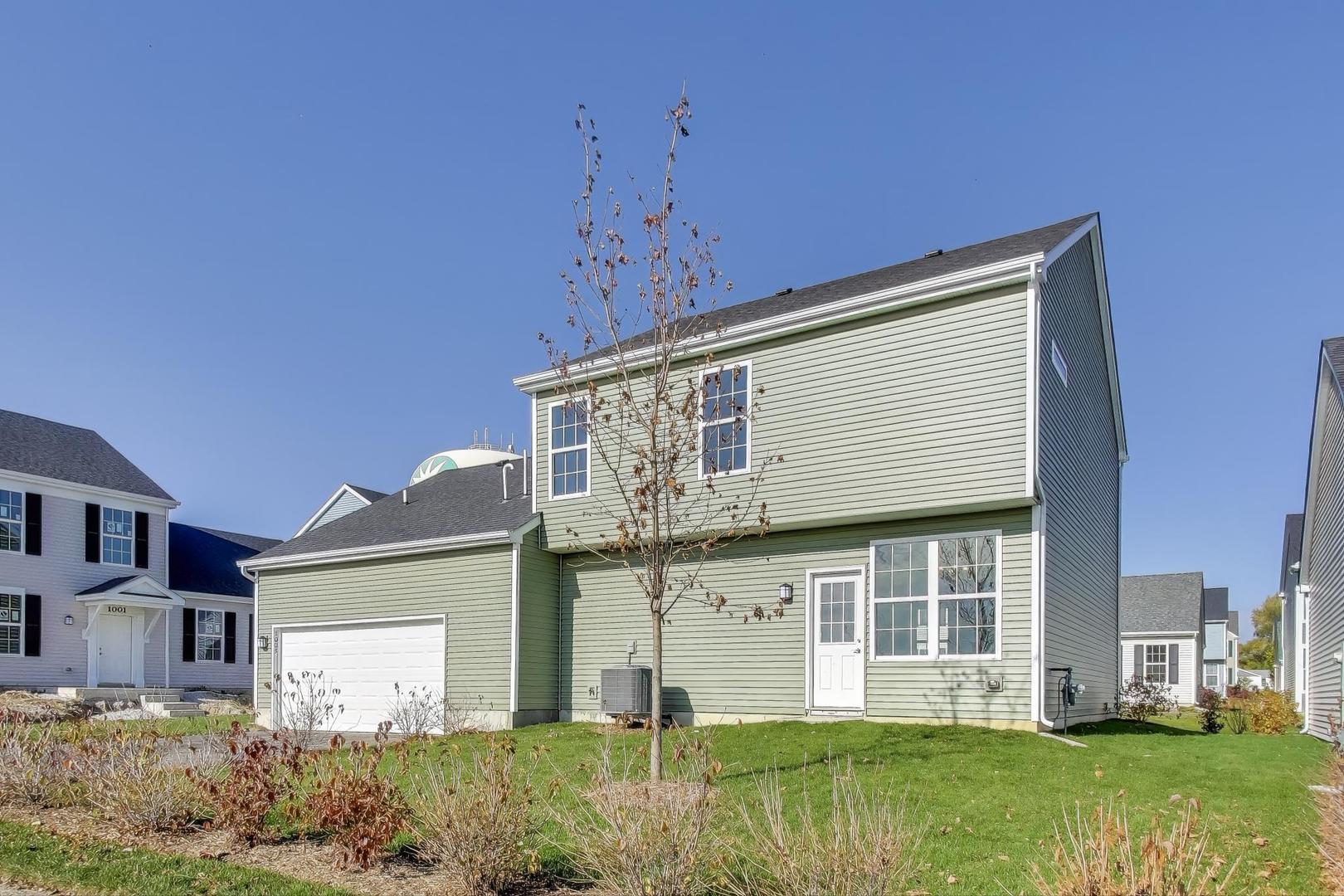 1003 Celebration Drive Aurora, IL 60504 - Photo 30 of 35 a front view of a house with garden