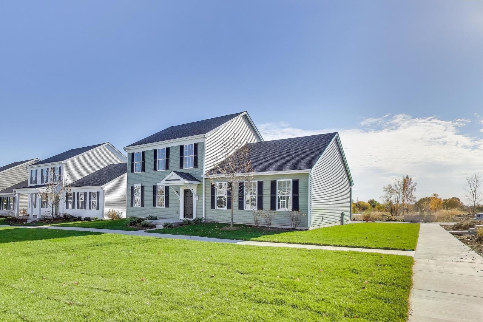 1003 Celebration Drive Aurora, IL 60504 - Photo 3 of 35 a view of a house with a yard