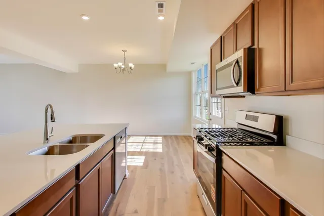 a kitchen that has a sink and a stove
