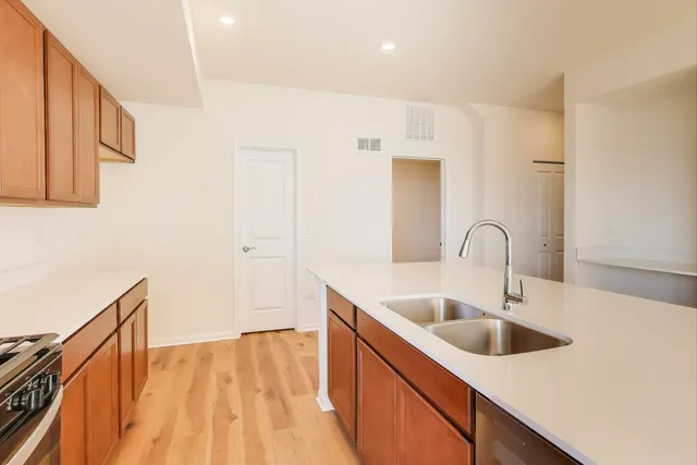 a kitchen with a sink and cabinets
