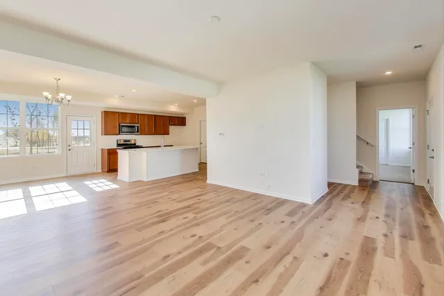 a view of a kitchen with a sink and a stove top oven