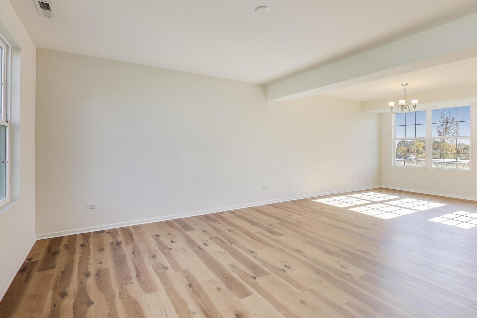 1003 Celebration Drive Aurora, IL 60504 - Photo 9 of 35 a view of empty room with wooden floor
