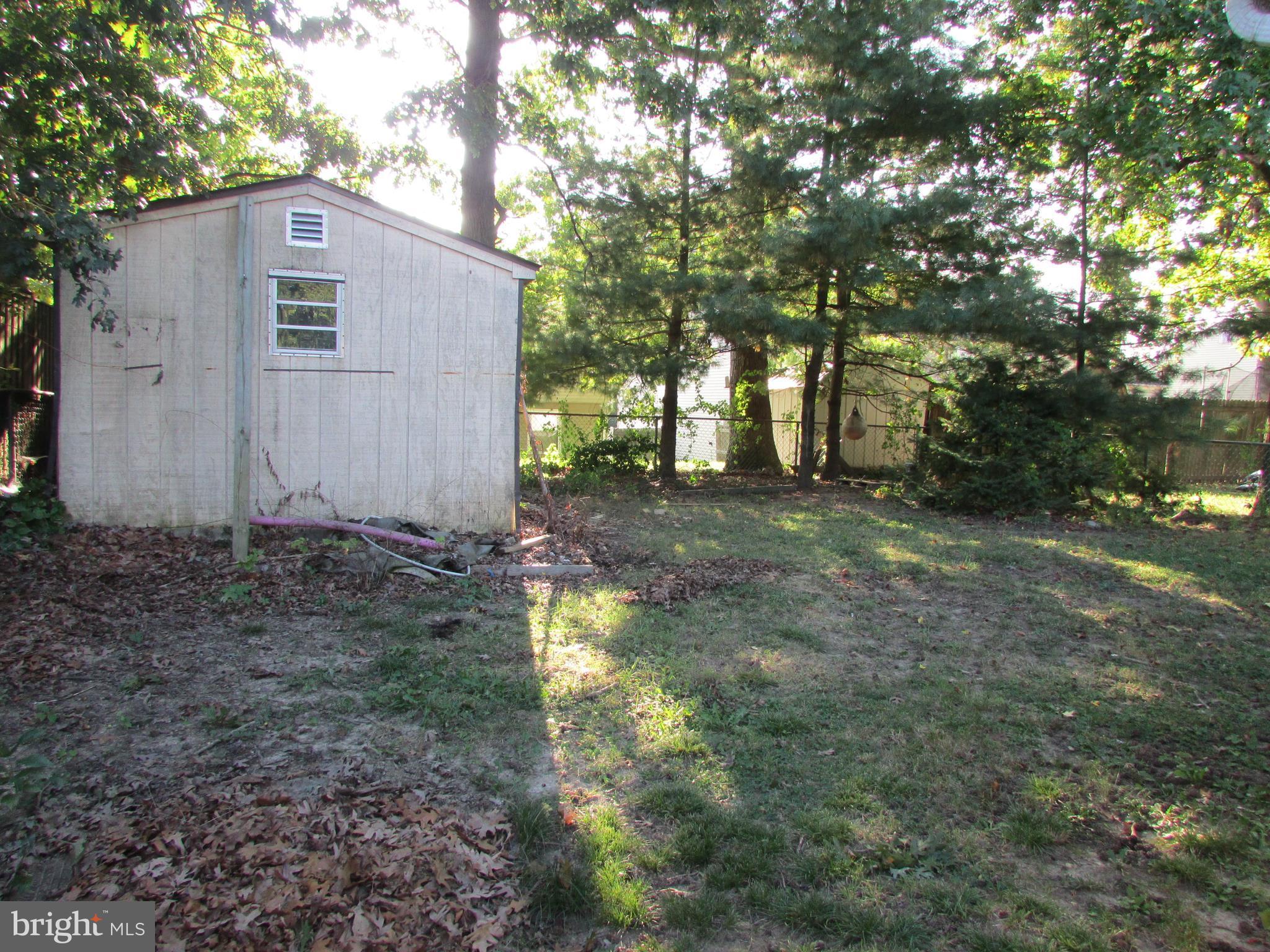 124 Redbud Road Edgewood, MD 21040 - Photo 3 of 12 a view of a yard with trees in the background
