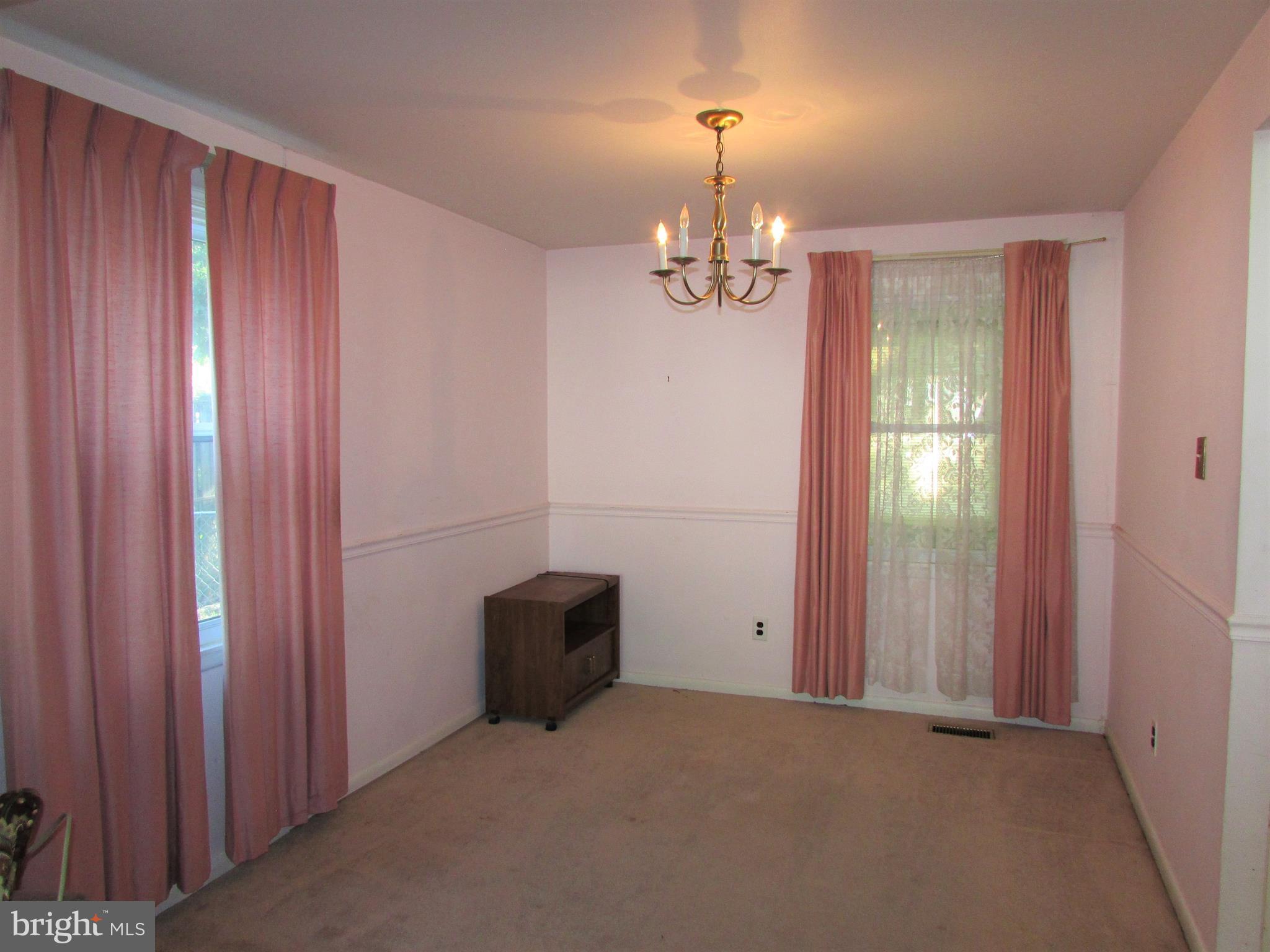 124 Redbud Road Edgewood, MD 21040 - Photo 8 of 12 an empty room with a chandelier fan
