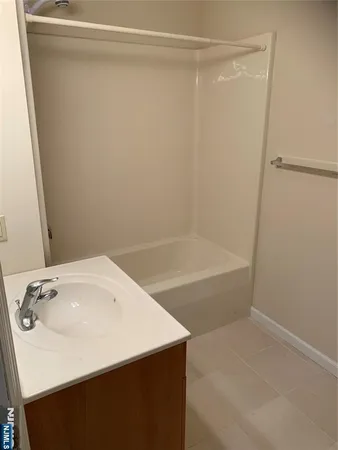 a bathroom with a sink and a bathtub