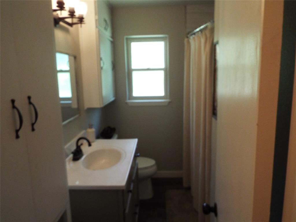 808 Shady Trail Athens, TX 75751 - Photo 12 of 22 a bathroom with a sink and a mirror