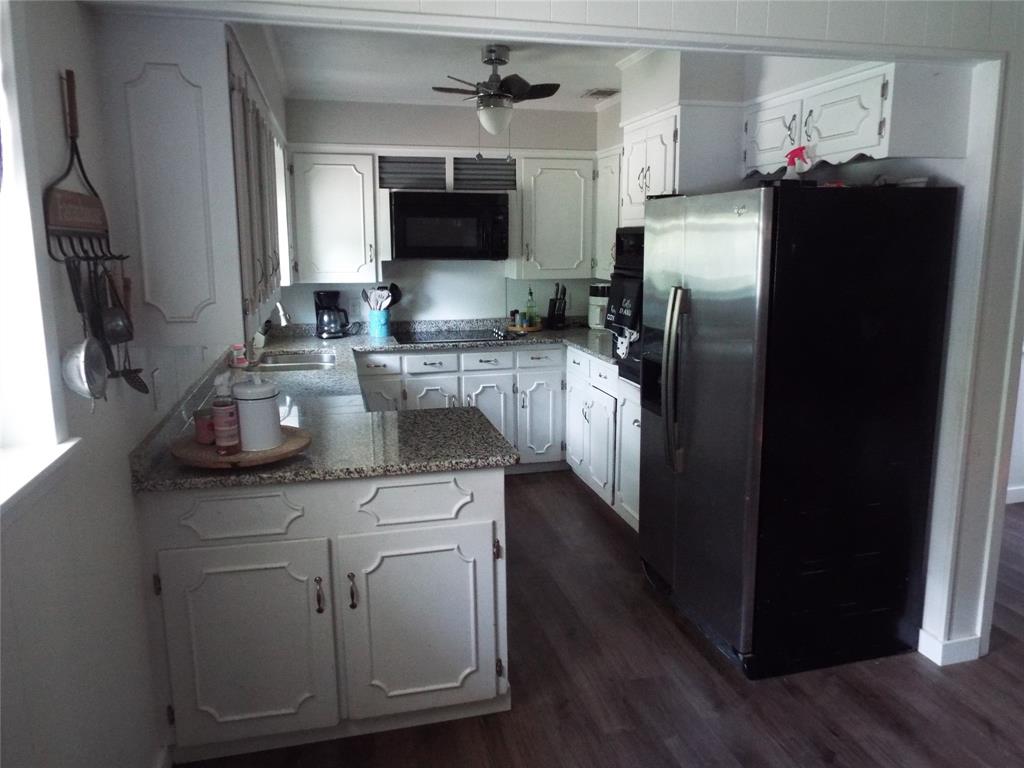 808 Shady Trail Athens, TX 75751 - Photo 13 of 22 a kitchen with a refrigerator sink and microwave