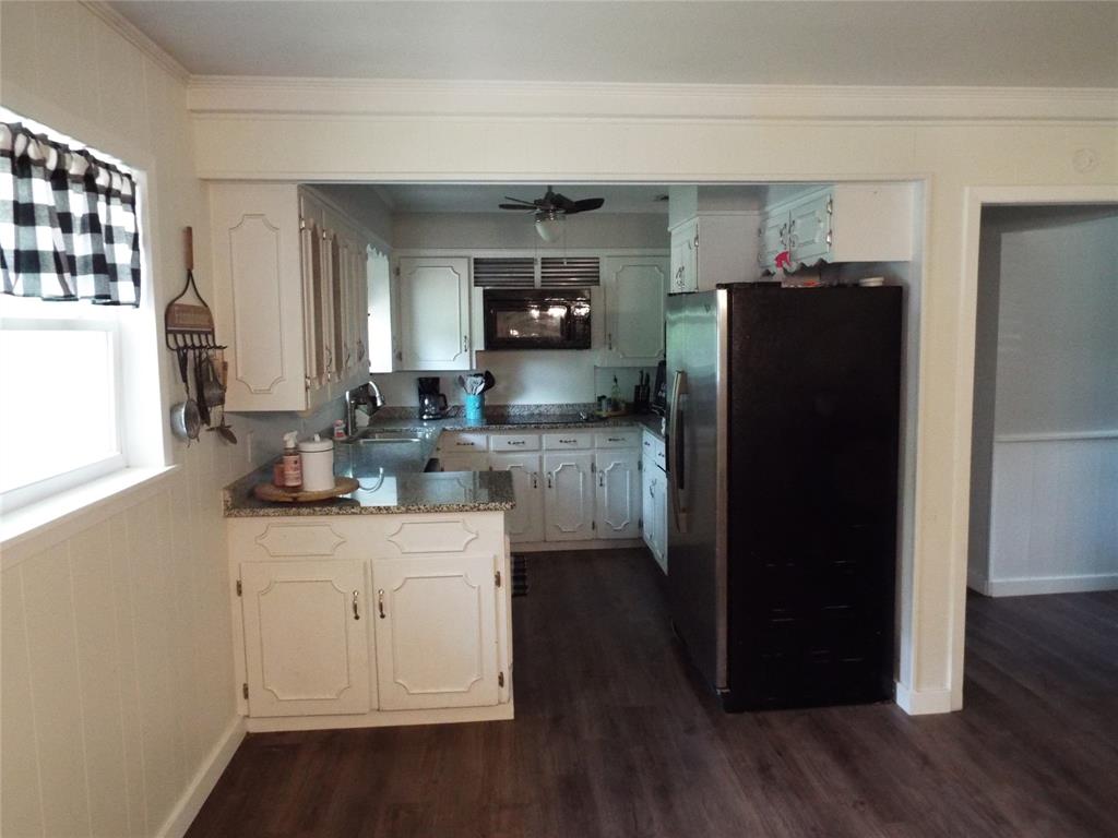 808 Shady Trail Athens, TX 75751 - Photo 15 of 22 a kitchen with a refrigerator and a sink