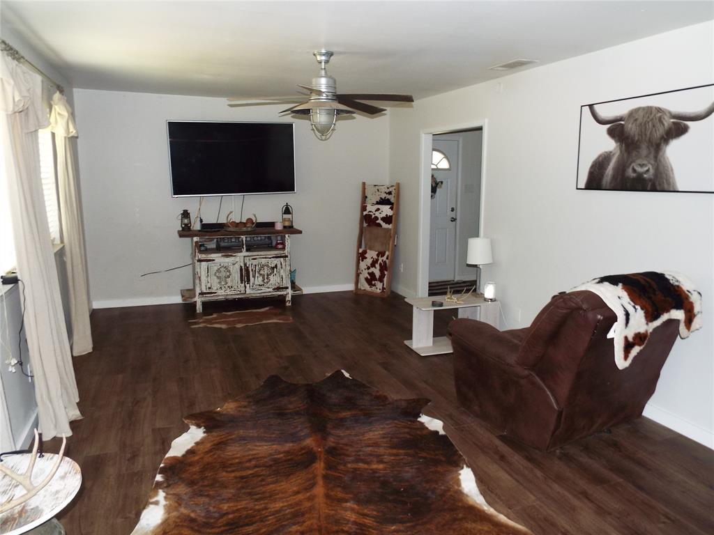 808 Shady Trail Athens, TX 75751 - Photo 16 of 22 a living room with furniture and a flat screen tv