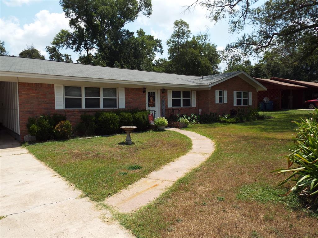 808 Shady Trail Athens, TX 75751 - Photo 2 of 22 a view of a yard in front of a house