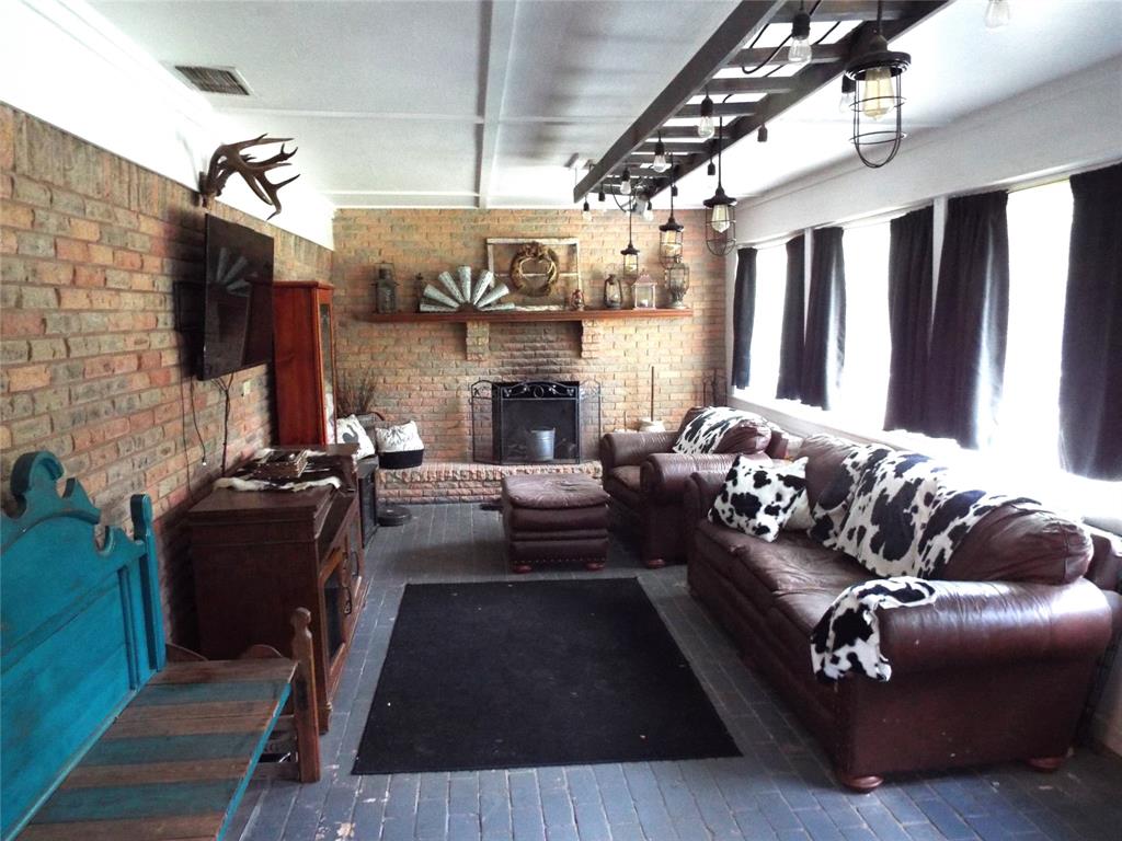 808 Shady Trail Athens, TX 75751 - Photo 22 of 22 a living room with furniture and a fireplace