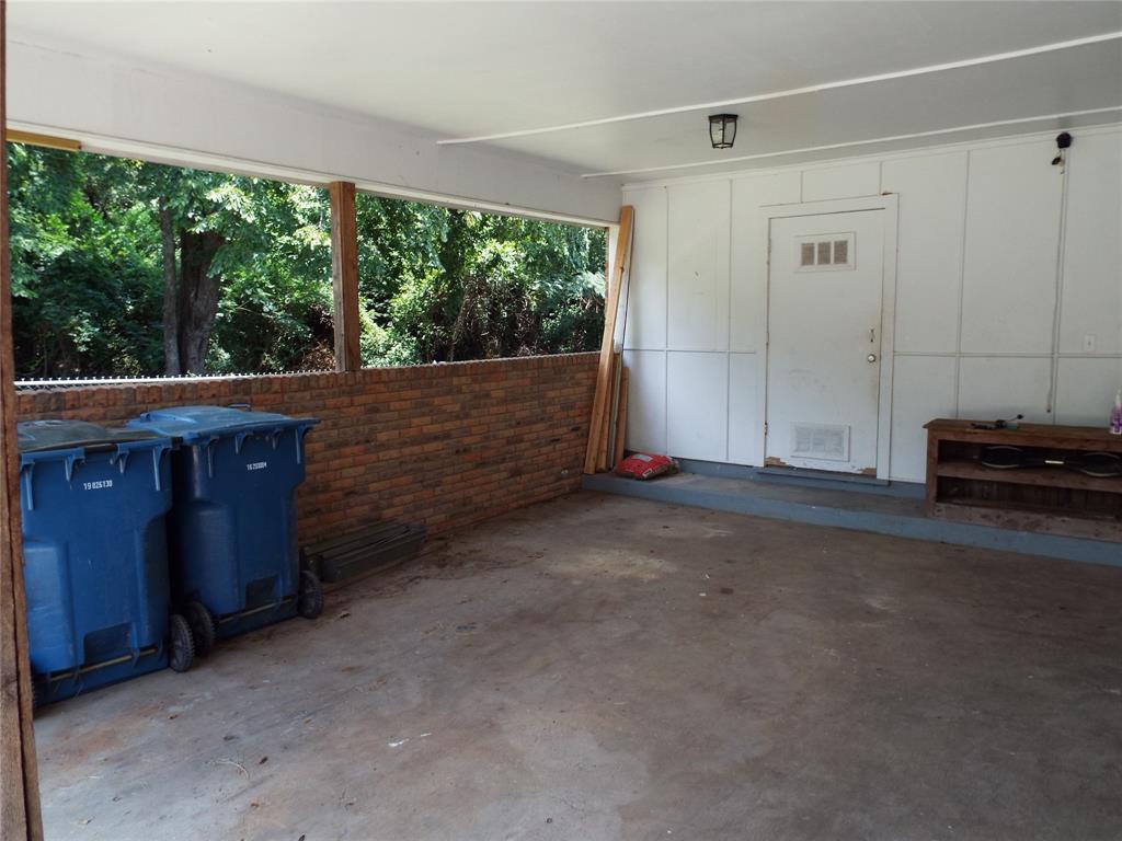 808 Shady Trail Athens, TX 75751 - Photo 8 of 22 a view of room with floor to ceiling window