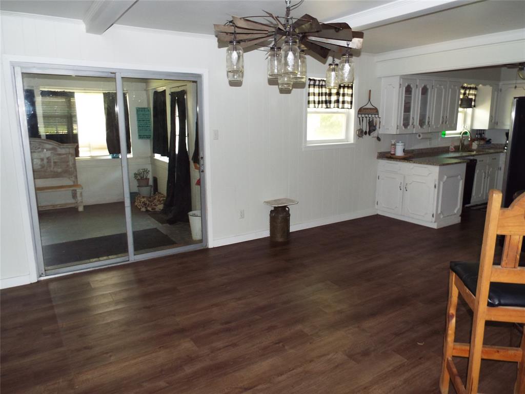 808 Shady Trail Athens, TX 75751 - Photo 10 of 22 an empty room with wooden floor and windows