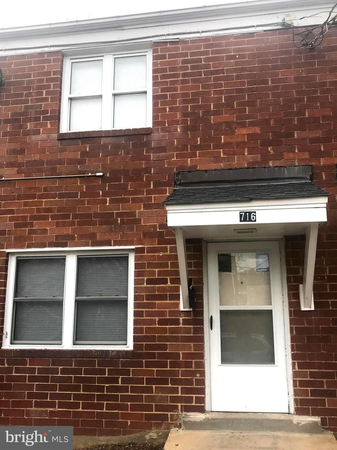 716 Four Mile Road Alexandria, VA 22305 - Photo 1 of 1 a view of a brick house with a door