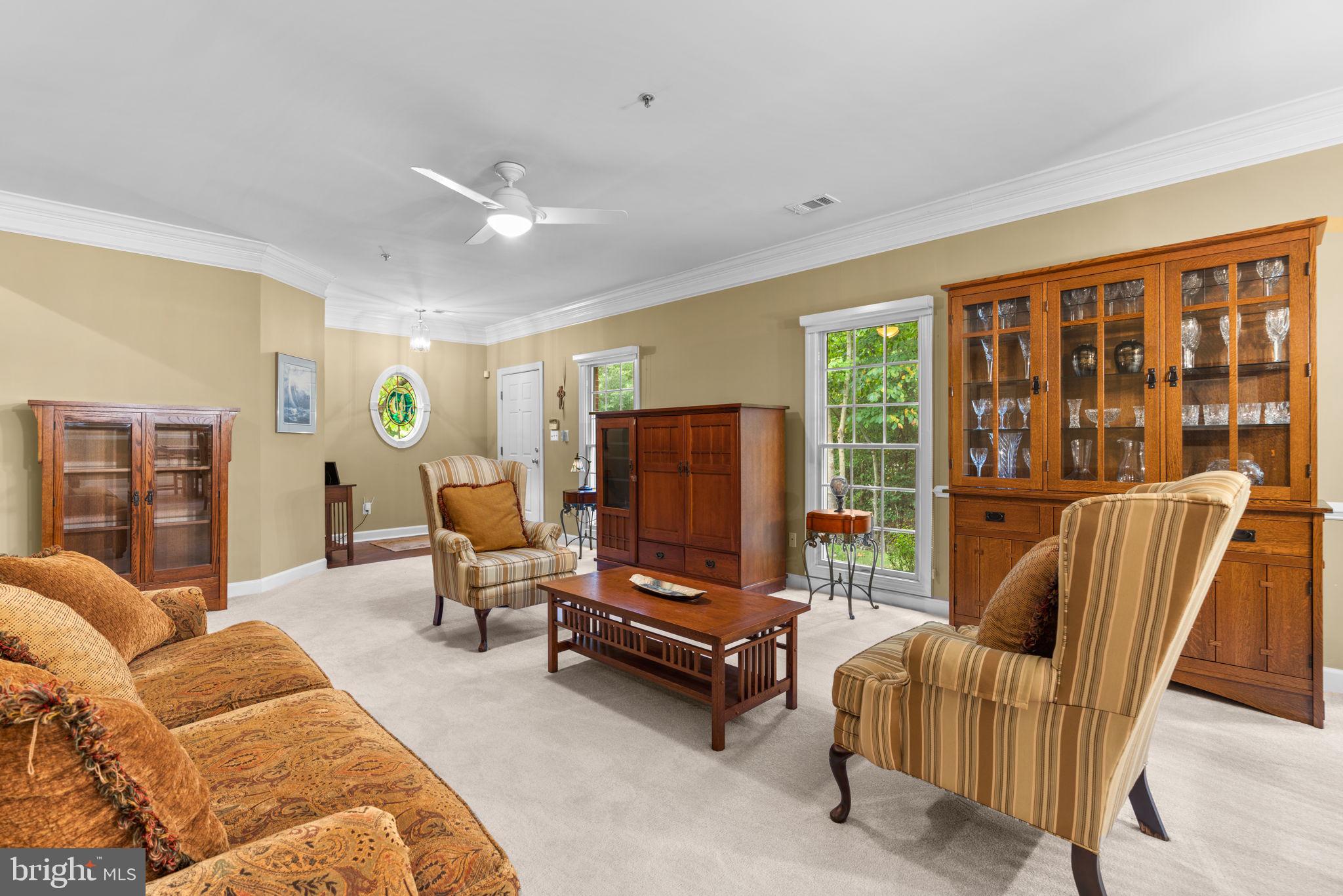 344 Colony Point Place Edgewater, MD 21037 - Photo 6 of 55 a living room with furniture and a flat screen tv