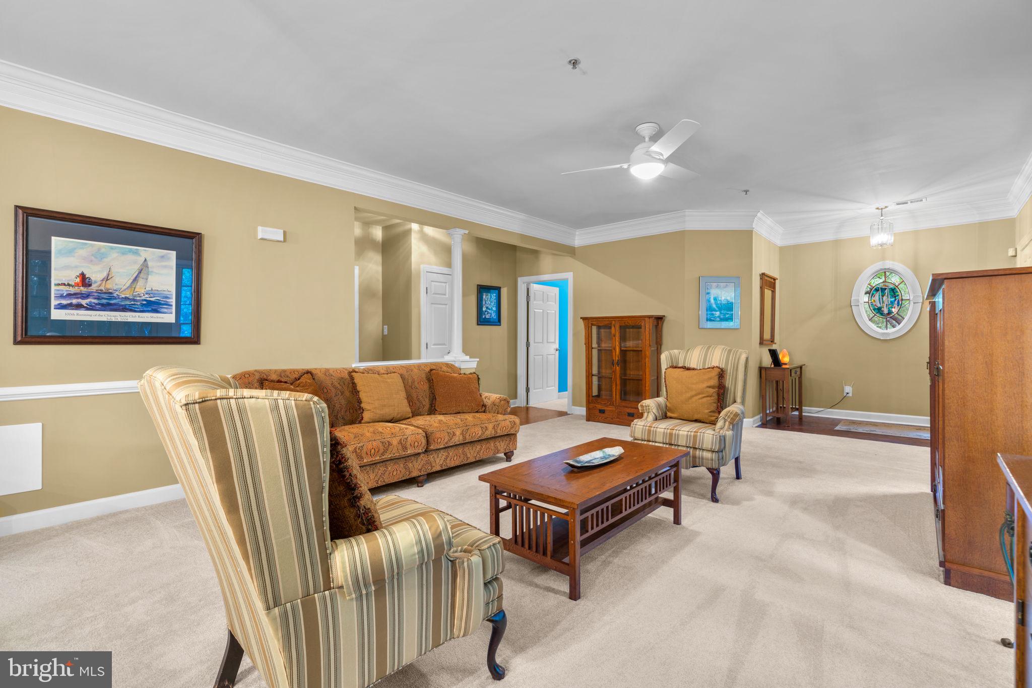 344 Colony Point Place Edgewater, MD 21037 - Photo 8 of 55 a living room with furniture and wooden floor
