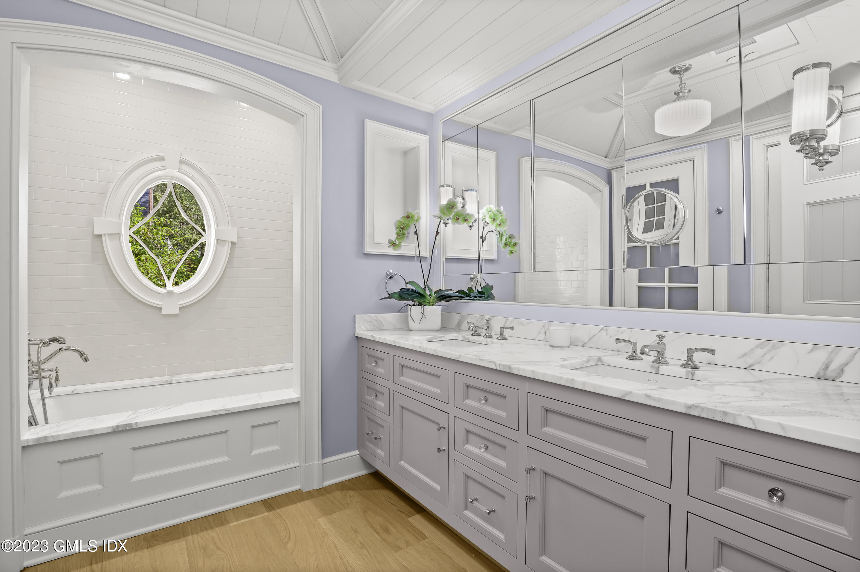 702 Steamboat Road, Unit 1 Greenwich, CT 06830 - Photo 16 of 25 a bathroom with a granite countertop sink and a mirror