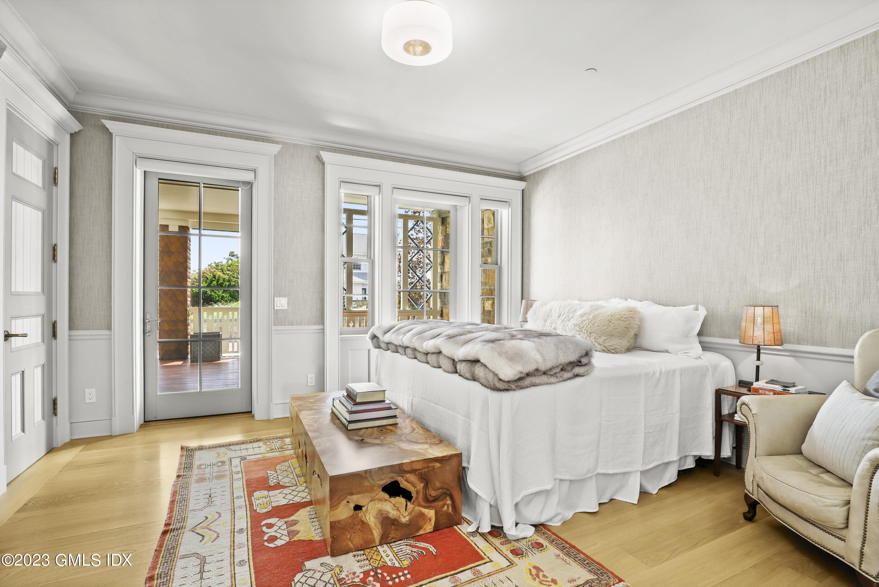 702 Steamboat Road, Unit 1 Greenwich, CT 06830 - Photo 17 of 25 a bedroom with a bed and a large window