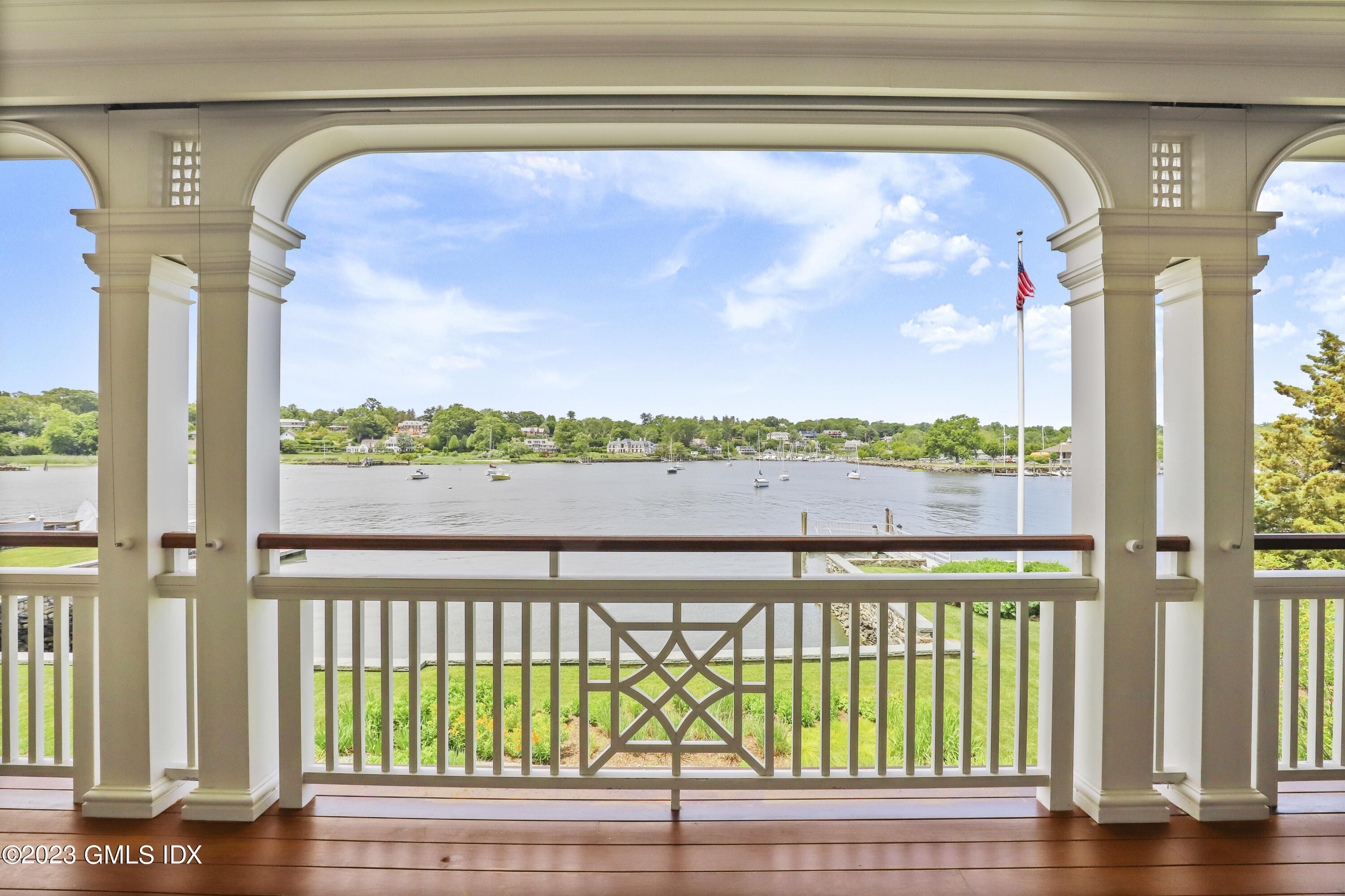 702 Steamboat Road, Unit 1 Greenwich, CT 06830 - Photo 6 of 25 a view of a porch with a floor to ceiling window