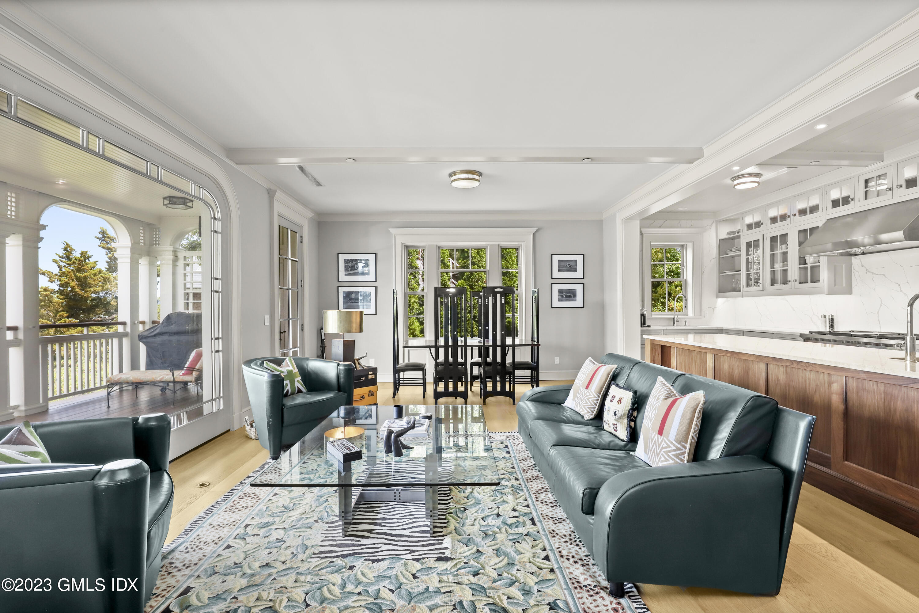702 Steamboat Road, Unit 1 Greenwich, CT 06830 - Photo 9 of 25 a living room with furniture and a large window