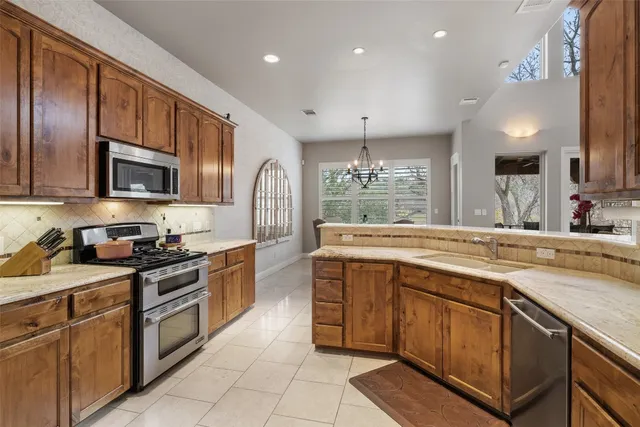 a living room with furniture a rug and a fireplace