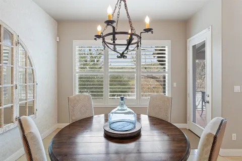 a spacious bedroom with a bed and a desk