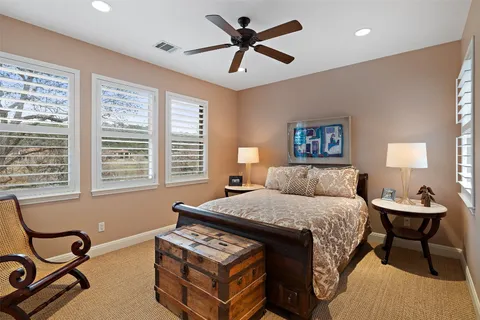 a view of a living room with furniture and flat screen tv